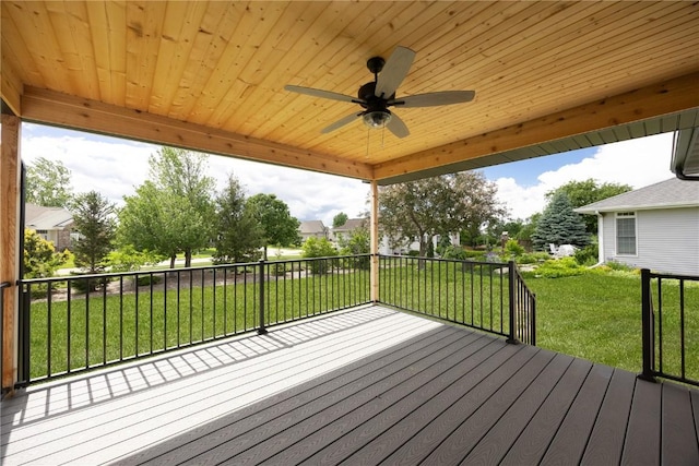 wooden terrace with a yard and ceiling fan