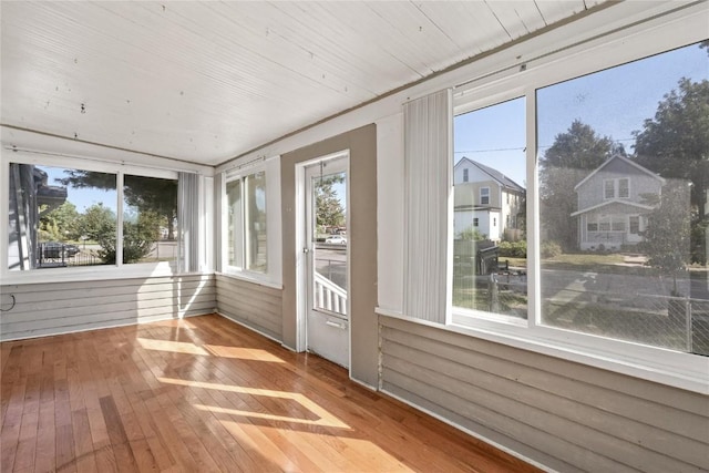 unfurnished sunroom featuring wooden ceiling