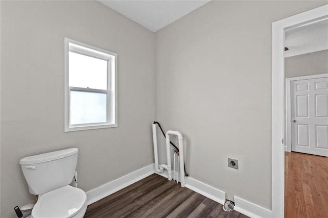 bathroom with toilet and hardwood / wood-style floors