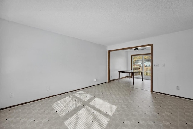 empty room featuring a textured ceiling