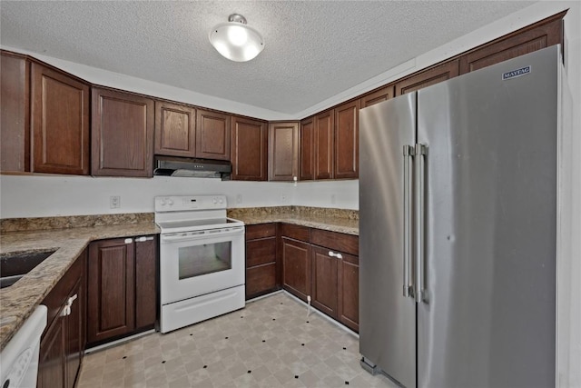 kitchen with sink, white appliances, dark brown cabinetry, light stone countertops, and a textured ceiling