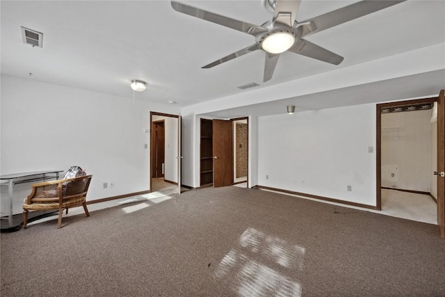 carpeted empty room featuring ceiling fan