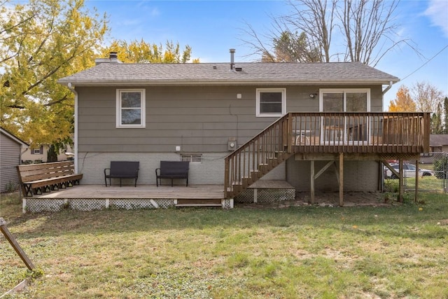 rear view of property featuring a yard and a deck