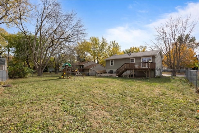 view of yard featuring a playground and a wooden deck