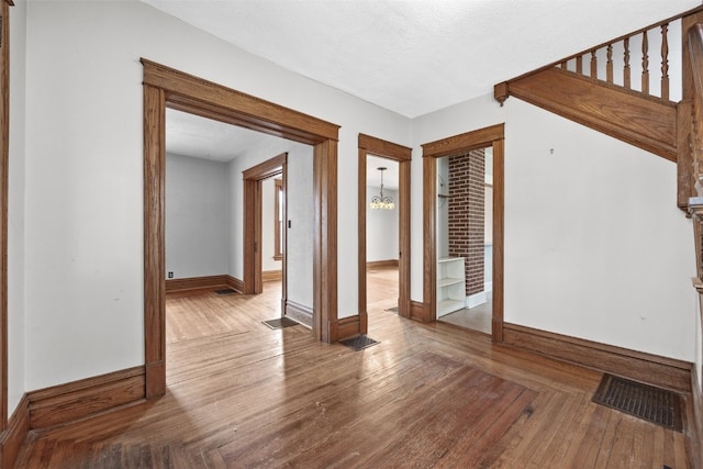 interior space featuring hardwood / wood-style flooring and a textured ceiling