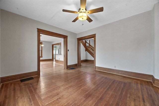 unfurnished room featuring wood-type flooring and ceiling fan