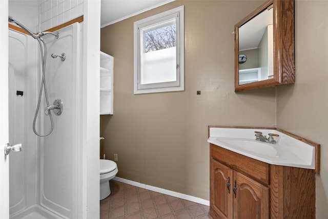 bathroom with vanity, a shower, and toilet