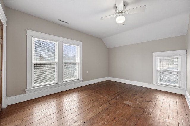 additional living space featuring lofted ceiling, hardwood / wood-style flooring, and ceiling fan