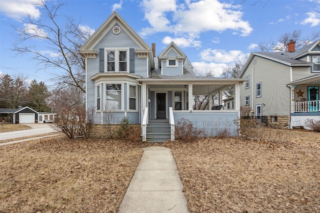 view of front facade featuring a porch and a garage