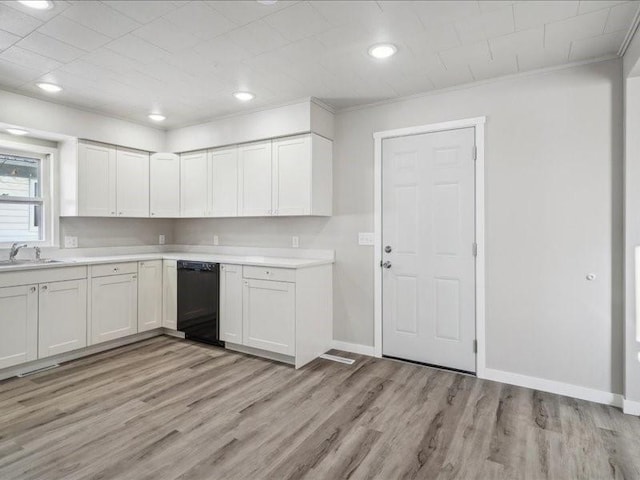 kitchen featuring white cabinetry, dishwasher, and light hardwood / wood-style floors