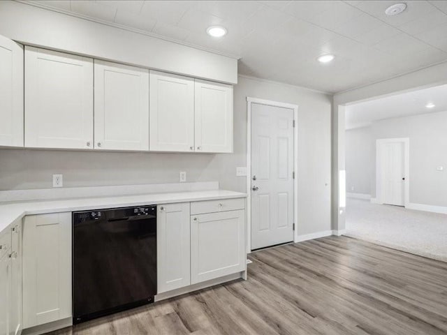 kitchen featuring white cabinetry, black dishwasher, and light hardwood / wood-style flooring