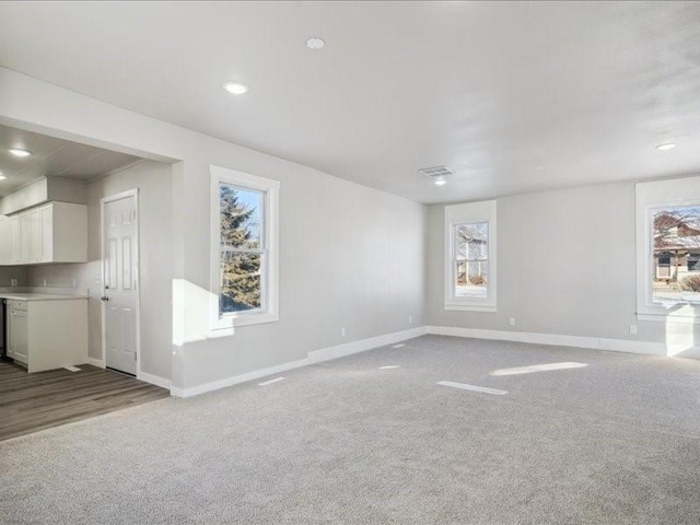 unfurnished living room with carpet