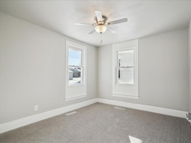 carpeted empty room with ceiling fan