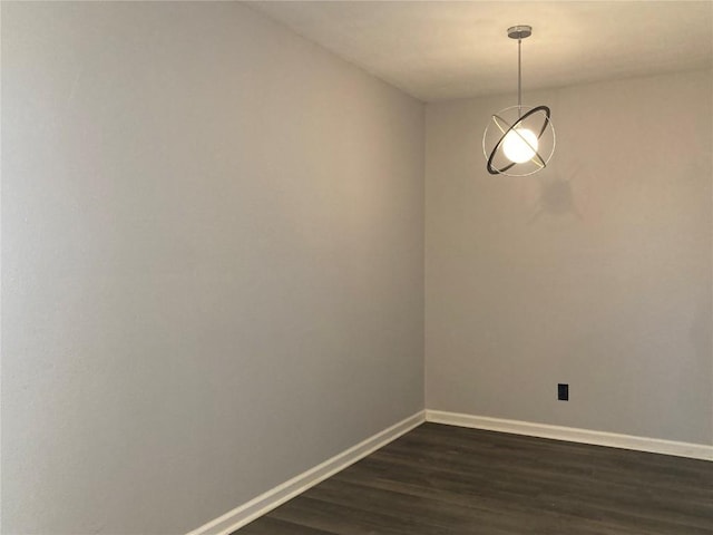 unfurnished room featuring dark hardwood / wood-style flooring