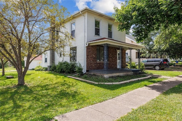 view of front of property with a porch and a front yard