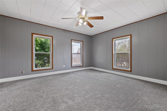 spare room with carpet floors and ceiling fan