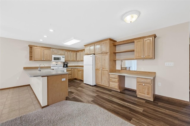 kitchen featuring light brown cabinetry, white appliances, built in desk, dark hardwood / wood-style flooring, and kitchen peninsula