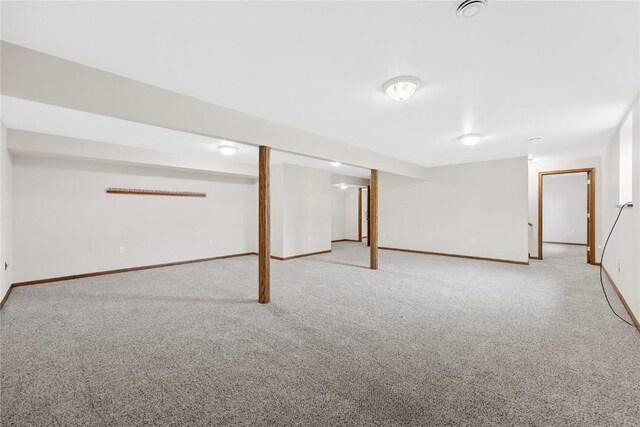 basement featuring carpet flooring