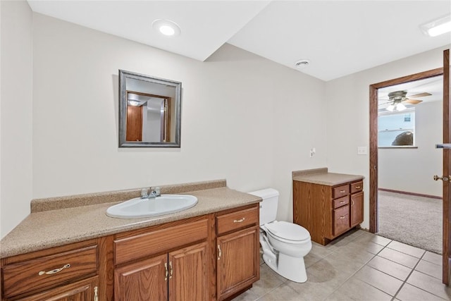 bathroom with vanity, ceiling fan, tile patterned floors, and toilet