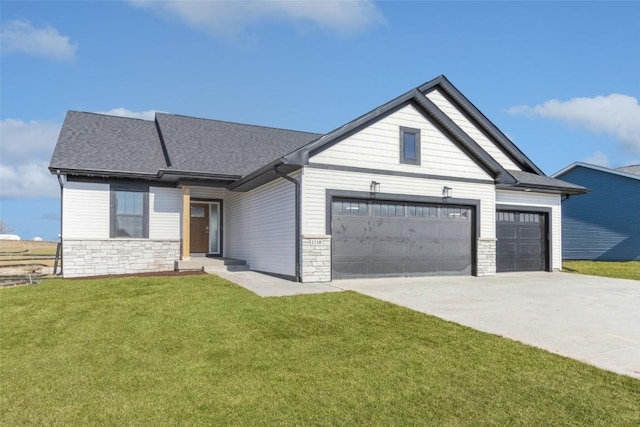 view of front of property with a garage and a front yard