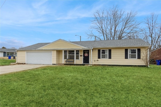 ranch-style house with a garage and a front yard