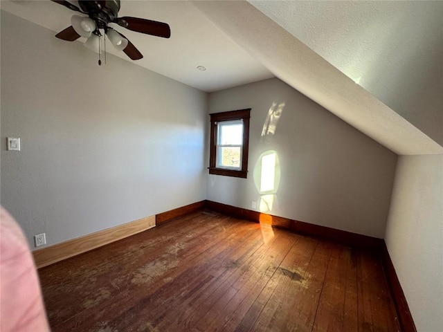 1609 11th Ave, Belle Plaine, IA 52208 - bonus room with wood-type flooring, a ceiling fan, baseboards, and vaulted ceiling