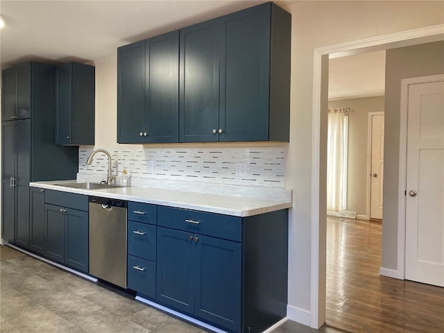 kitchen featuring tasteful backsplash, sink, stainless steel dishwasher, blue cabinetry, and light hardwood / wood-style flooring