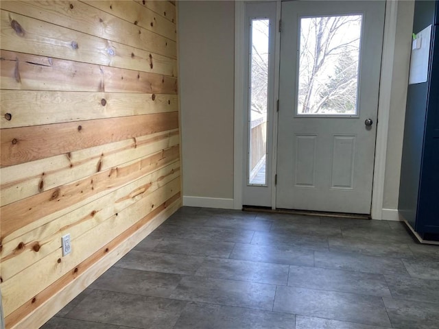 entrance foyer featuring wooden walls