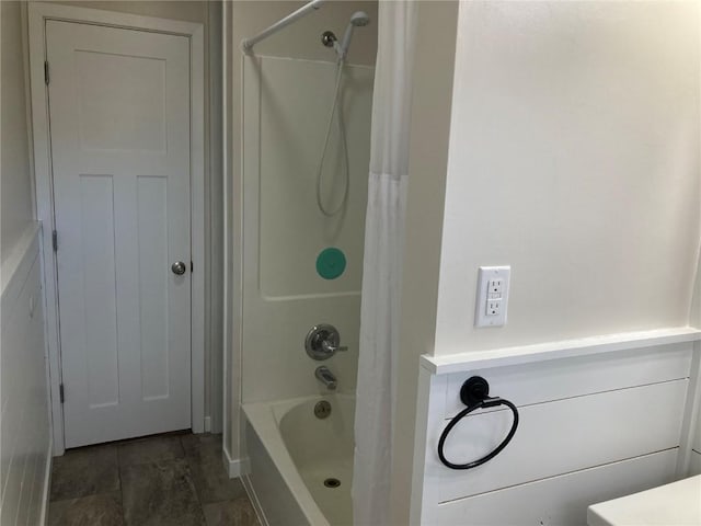 bathroom with shower / bath combo with shower curtain