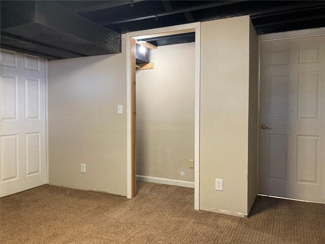 basement featuring carpet flooring