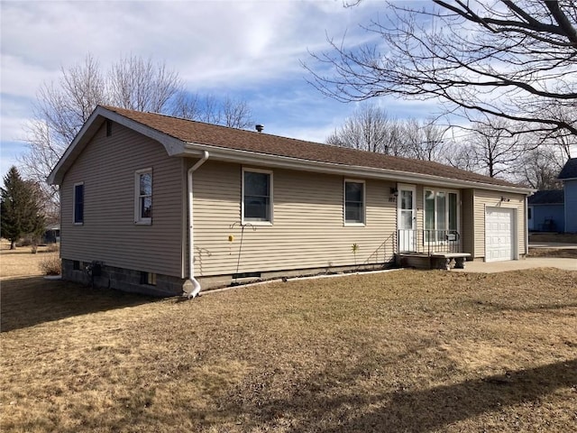 view of front of property with a garage and a front lawn