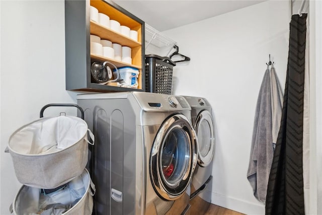 washroom featuring separate washer and dryer and dark wood-type flooring