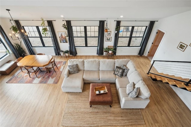 living room featuring hardwood / wood-style flooring and a chandelier