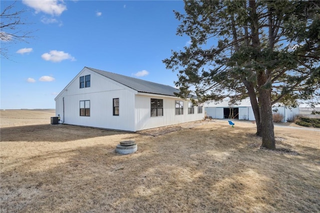 view of side of property with cooling unit