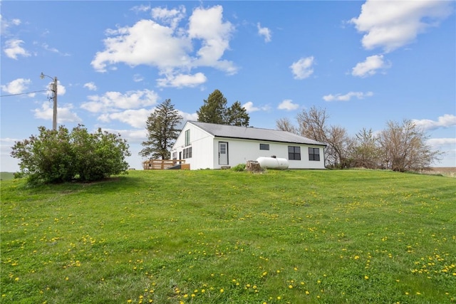 rear view of house with a lawn
