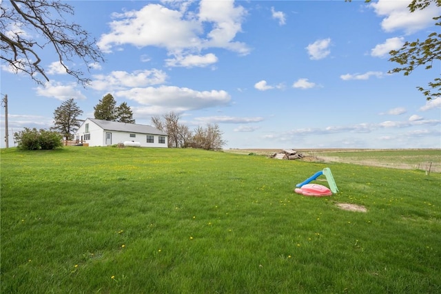 view of yard with a rural view