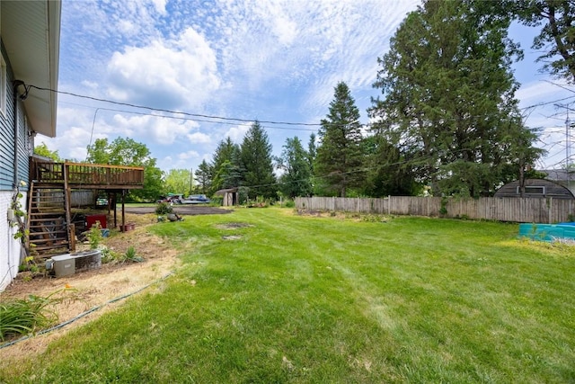 view of yard with a wooden deck