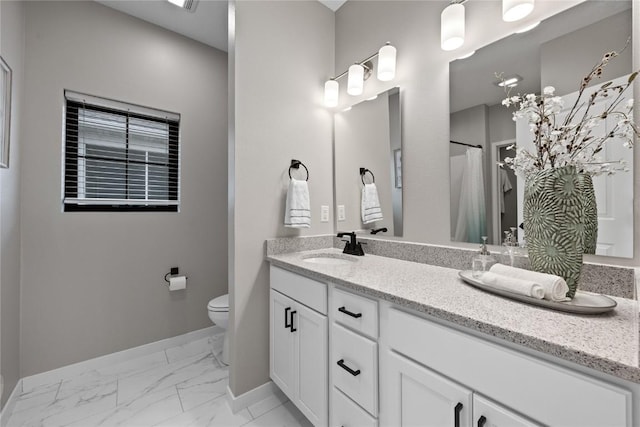 bathroom with vanity and toilet