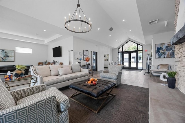 living room featuring french doors, an inviting chandelier, high vaulted ceiling, and hardwood / wood-style floors