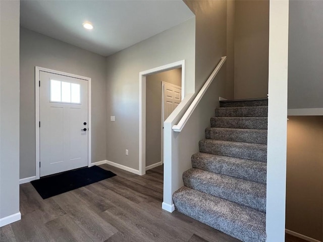 entryway with hardwood / wood-style floors