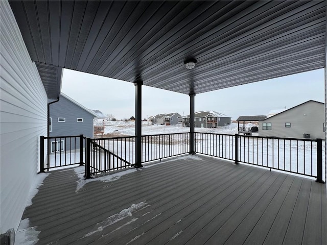 view of snow covered deck