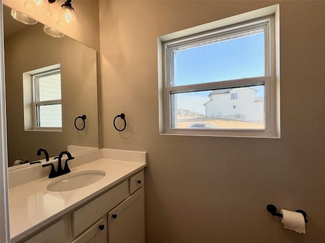 bathroom with vanity and plenty of natural light