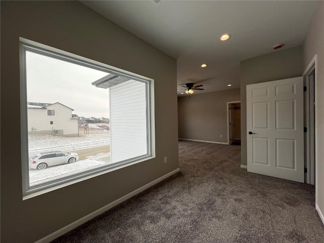 carpeted empty room with ceiling fan