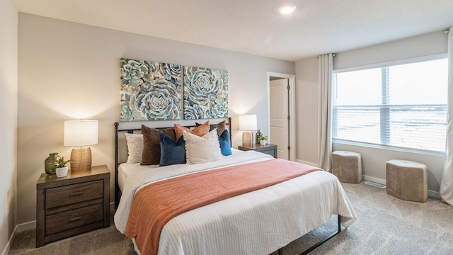 bedroom featuring light colored carpet