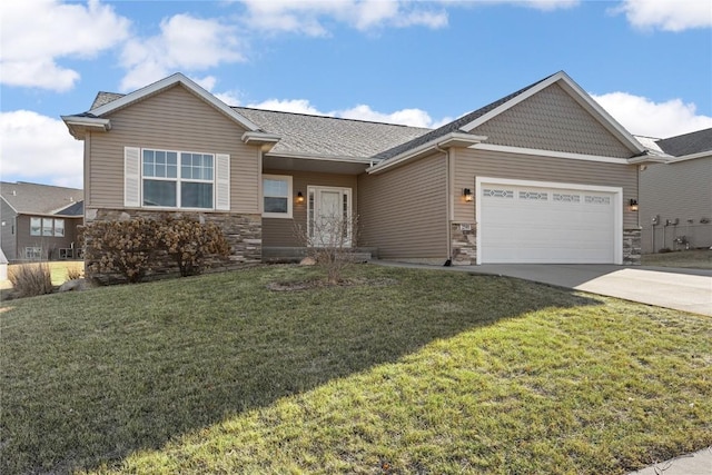 view of front of property featuring a garage and a front lawn