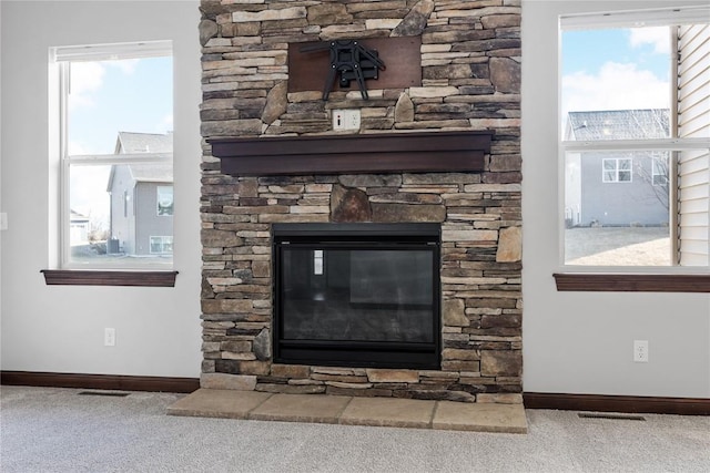 room details featuring carpet floors and a fireplace