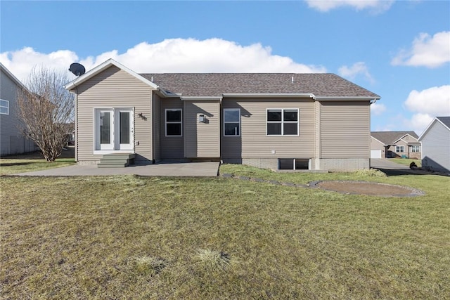 back of house featuring a patio area and a lawn