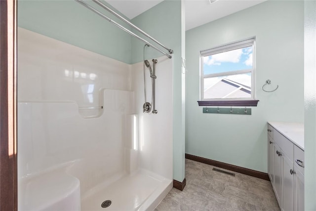 bathroom with vanity and walk in shower