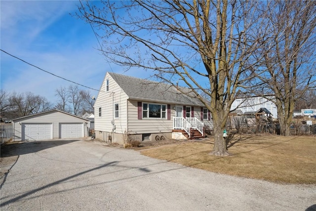 view of front of home featuring an outbuilding and a garage