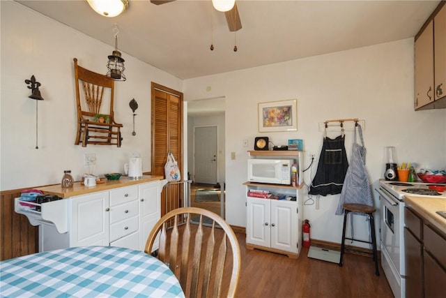 kitchen with ceiling fan, hardwood / wood-style floors, and white appliances